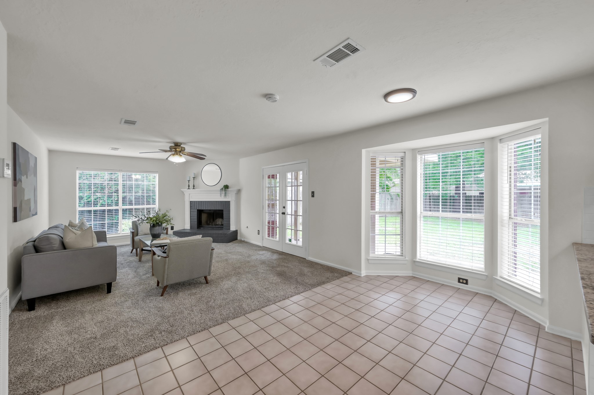 114 Regency Way Conroe, TX 77304 - Photo 21 of 48 Large breakfast area looking out to the backyard and open to kitchen and living room.