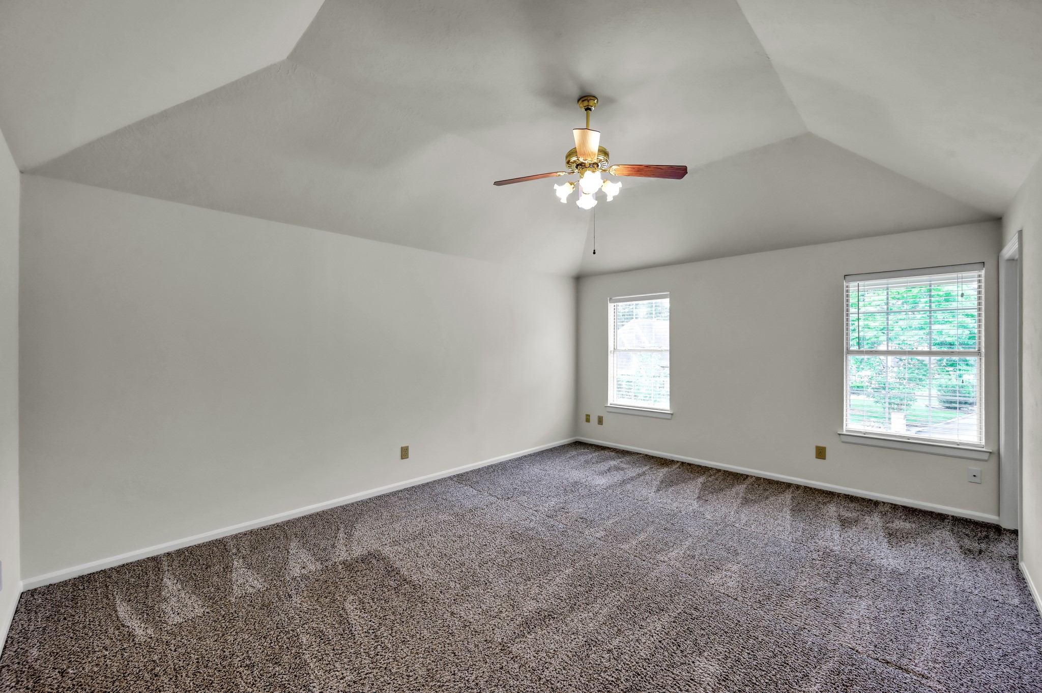 114 Regency Way Conroe, TX 77304 - Photo 26 of 48 Upstairs primary bedroom with vaulted ceilings, ensuite bath and adjacent 5 bedroom.