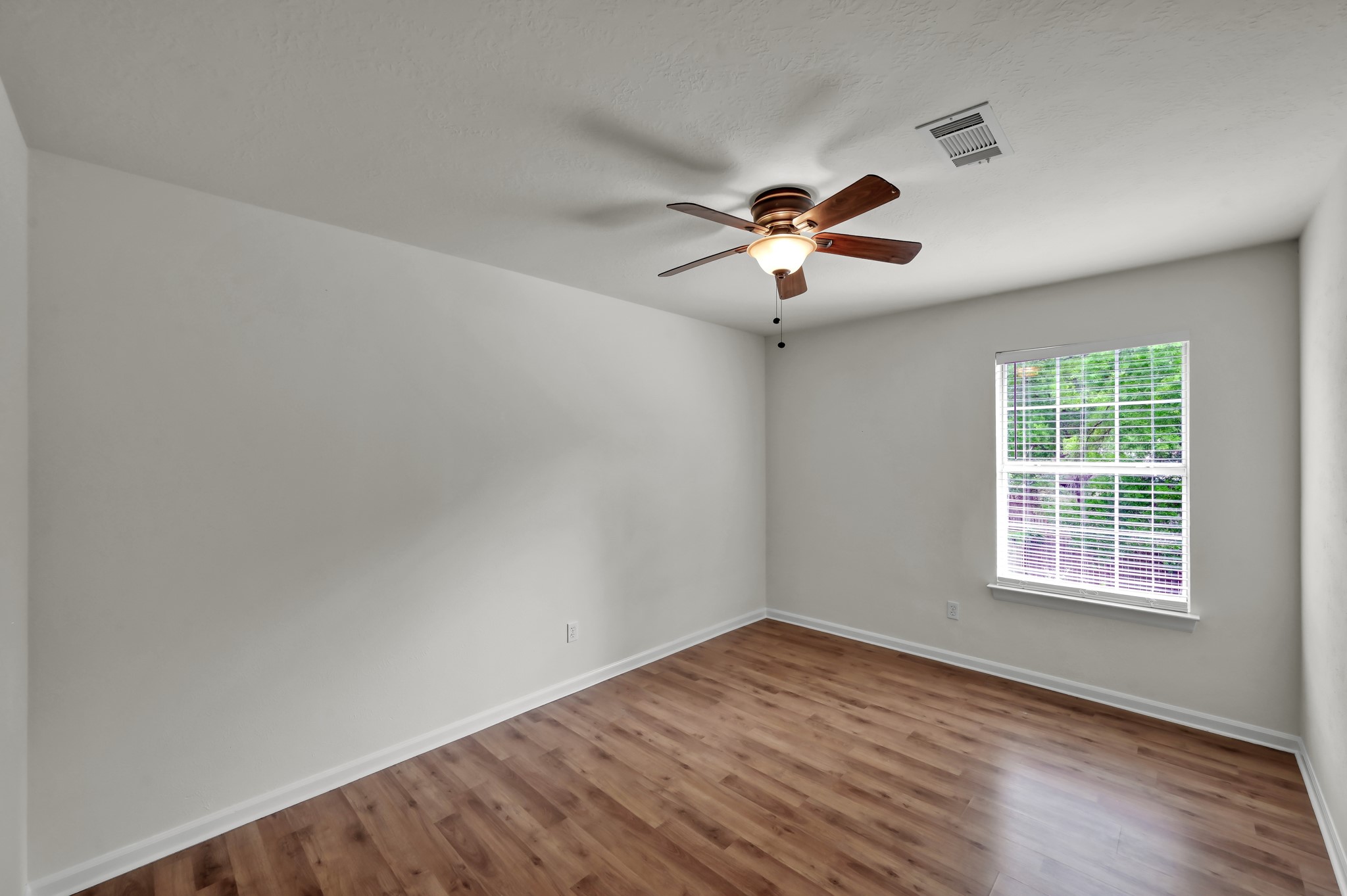 114 Regency Way Conroe, TX 77304 - Photo 34 of 48 Bedroom #4 of 5 with laminate flooring and large walk in closet.