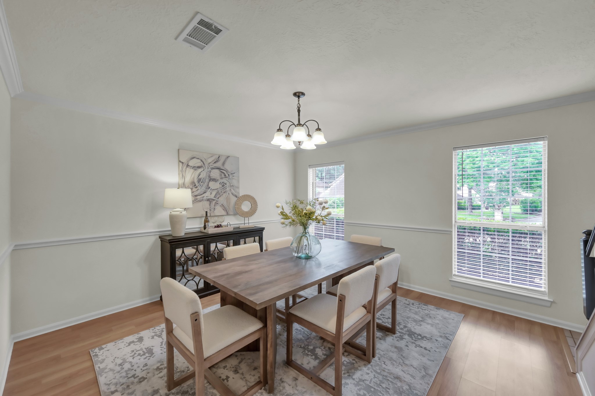 114 Regency Way Conroe, TX 77304 - Photo 7 of 48 Formal dining with crown molding and chair rail feature.