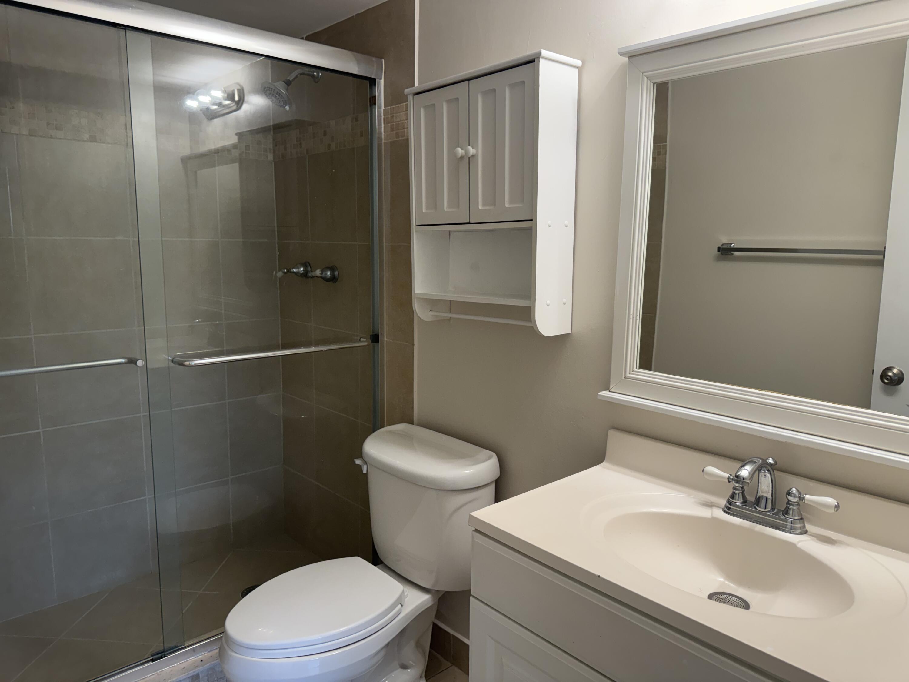 3710 North Pine Island Road, Unit 122 Sunrise, FL 33351 - Photo 17 of 39 a bathroom with a sink toilet and shower