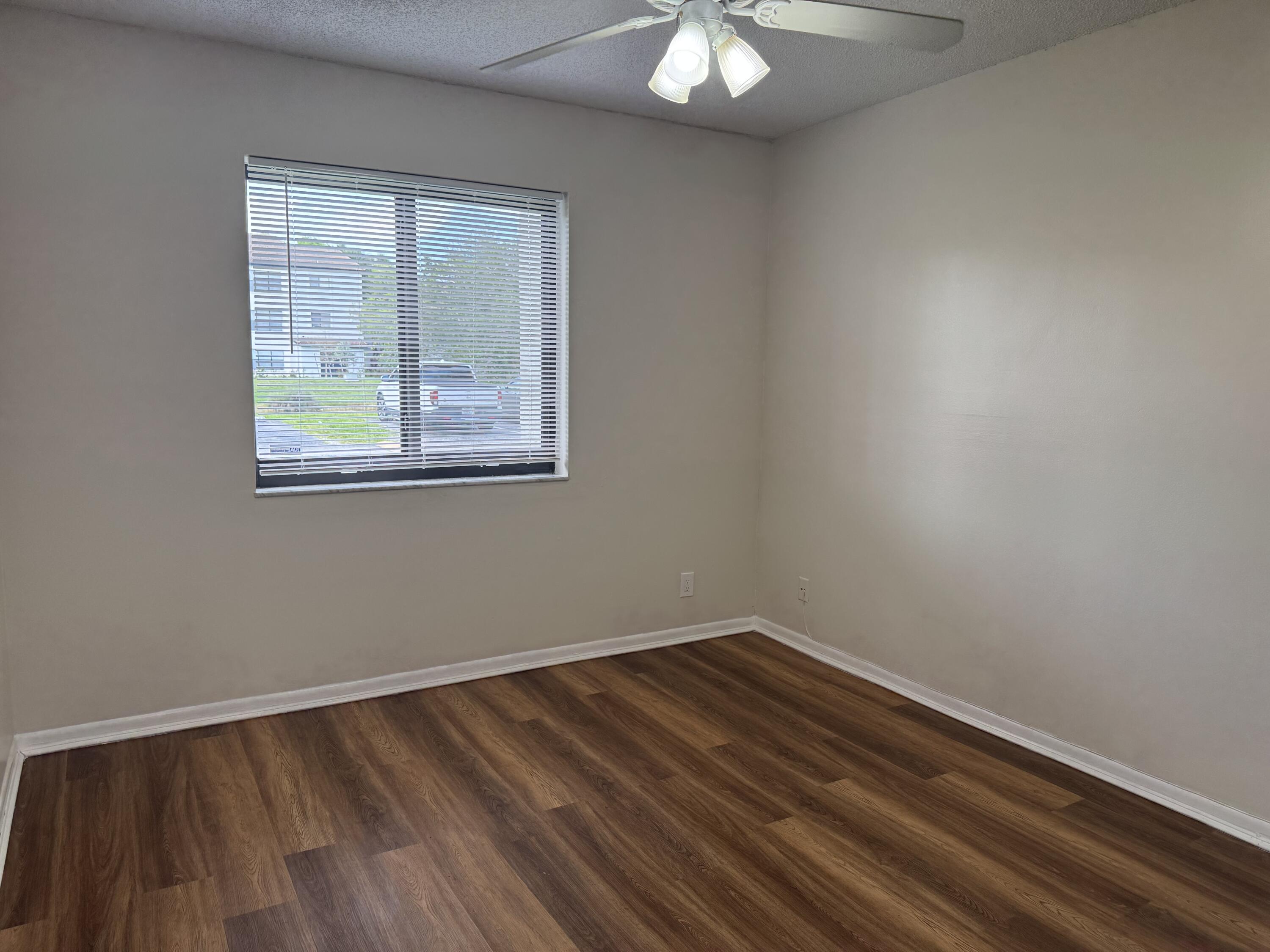 3710 North Pine Island Road, Unit 122 Sunrise, FL 33351 - Photo 22 of 39 an empty room with a window