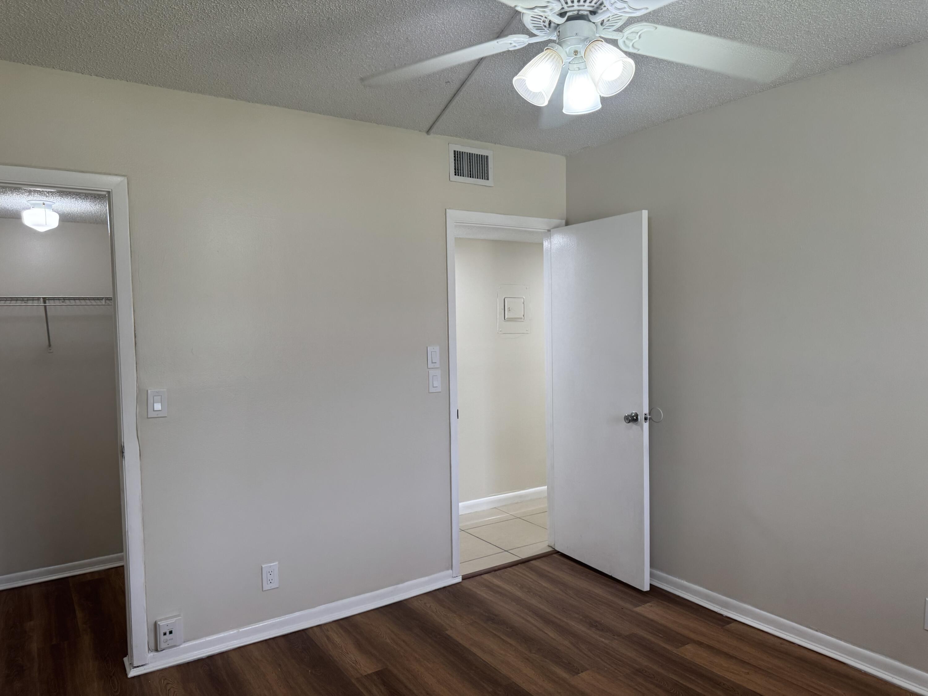 3710 North Pine Island Road, Unit 122 Sunrise, FL 33351 - Photo 24 of 39 an empty room with wooden floor fan and window