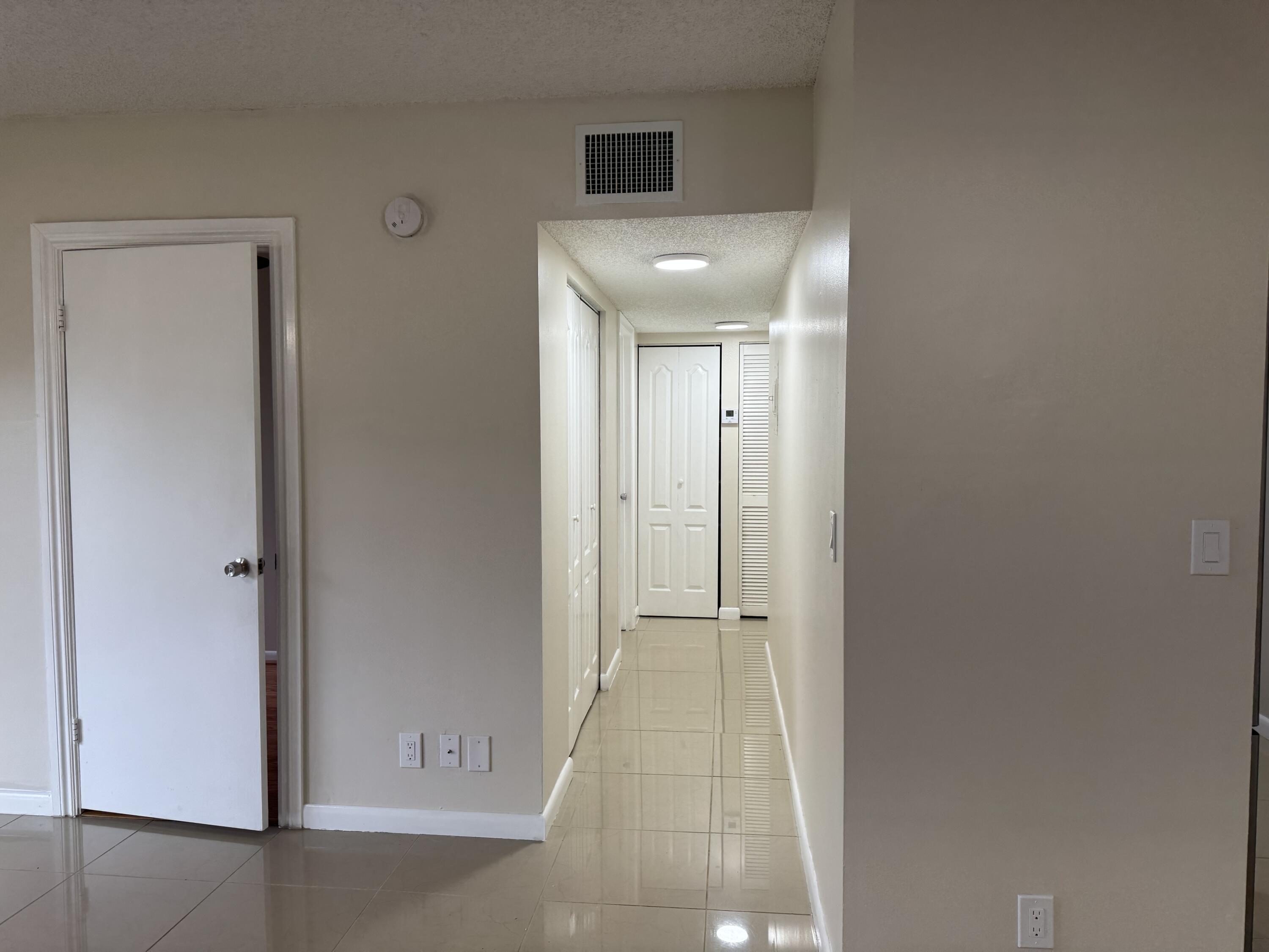 3710 North Pine Island Road, Unit 122 Sunrise, FL 33351 - Photo 33 of 39 a view of hallway with shower