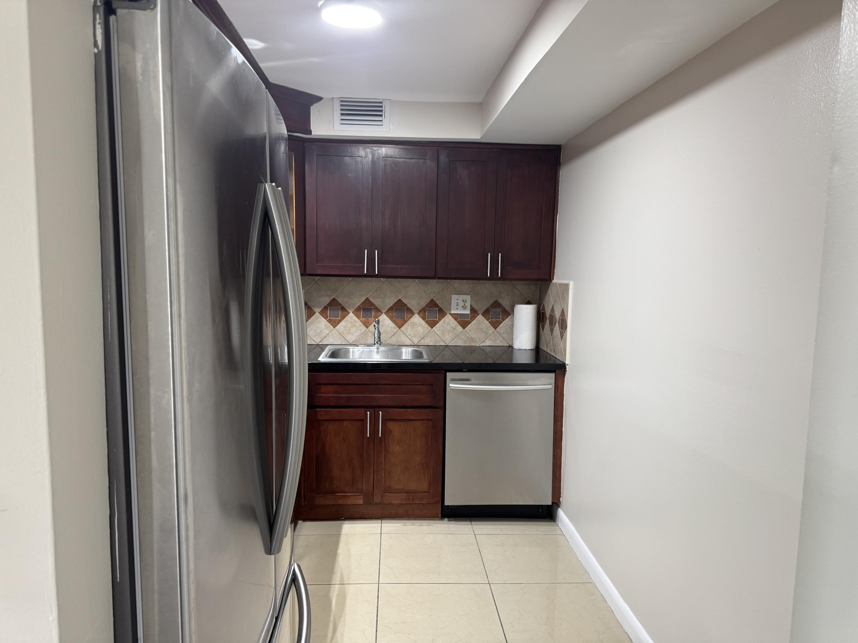 3710 North Pine Island Road, Unit 122 Sunrise, FL 33351 - Photo 9 of 39 a view of washer and dryer