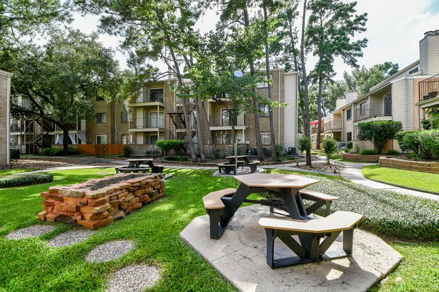 a view of a house with backyard sitting area and swimming pool