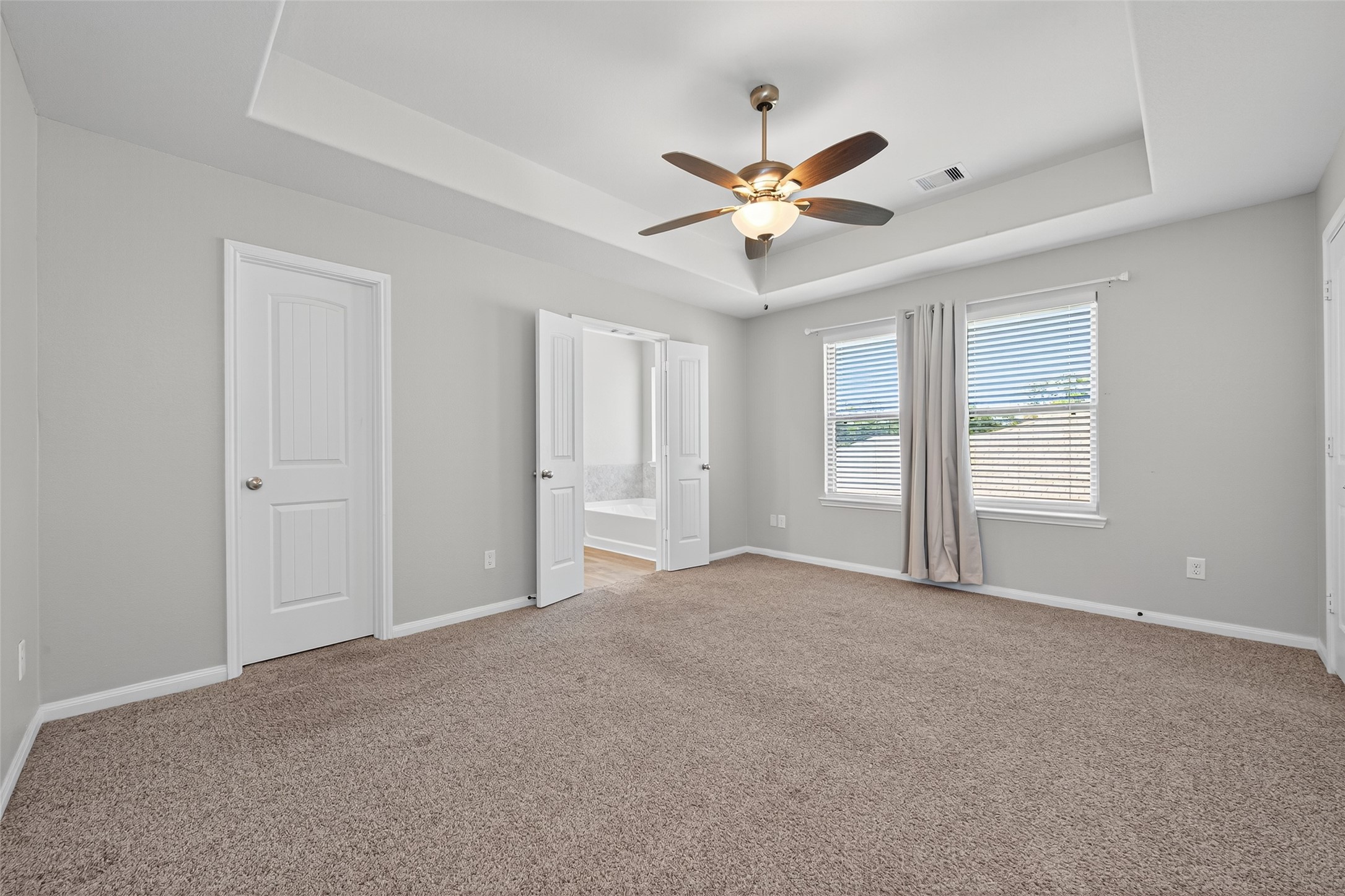 26108 Morgan Cemetery Road Cleveland, TX 77328 - Photo 22 of 39 a view of a big room with chandelier fan and windows