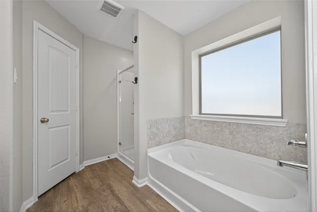 a white bath tub sitting in a bathroom