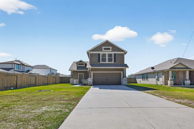 a view of house with a garden and yard