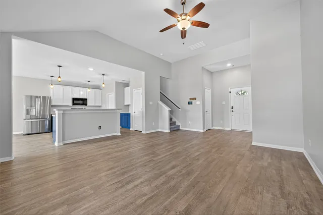 a view of a kitchen with a sink and a window