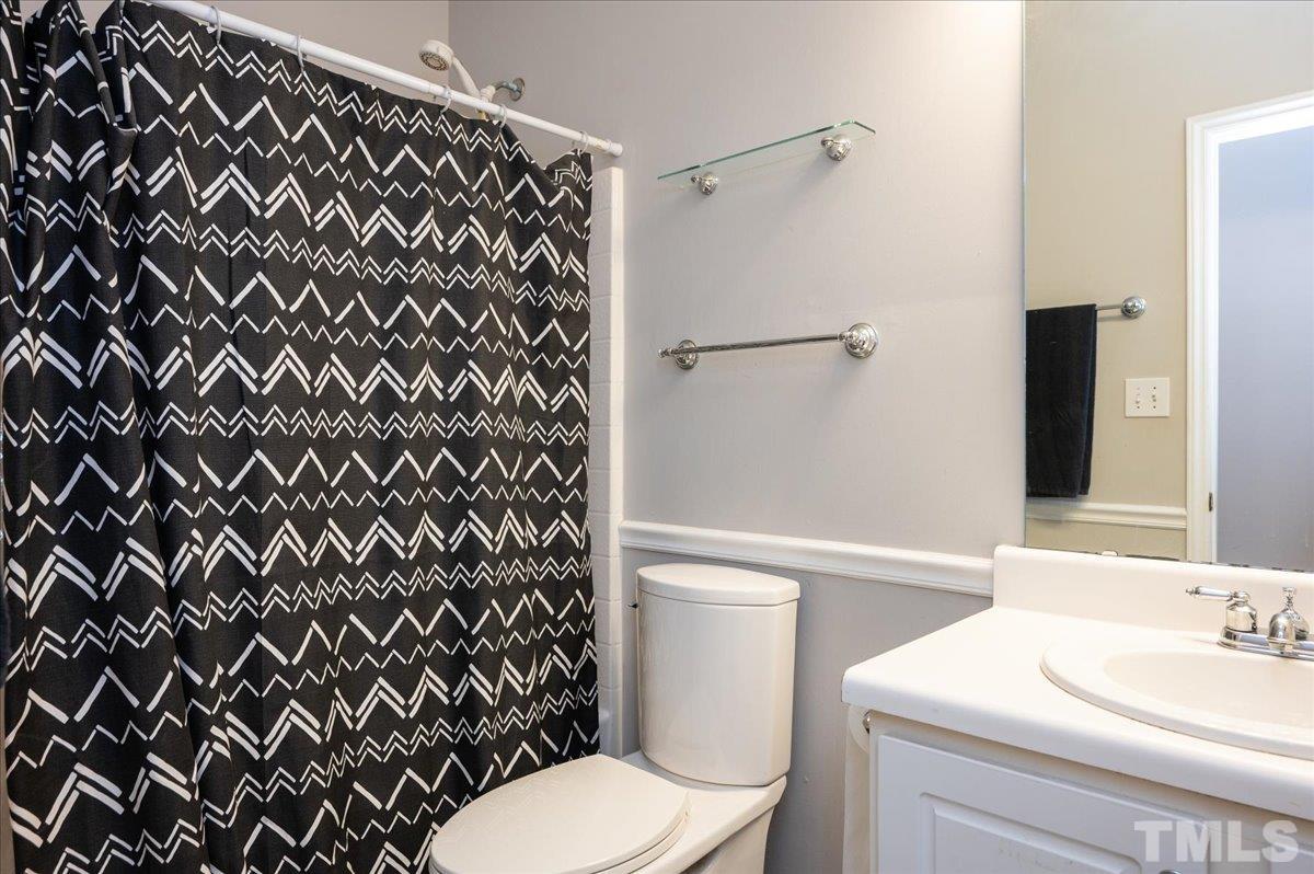 8616 Neuse Stone Drive Raleigh, NC 27616 - Photo 19 of 24 a bathroom with a granite countertop toilet and a sink