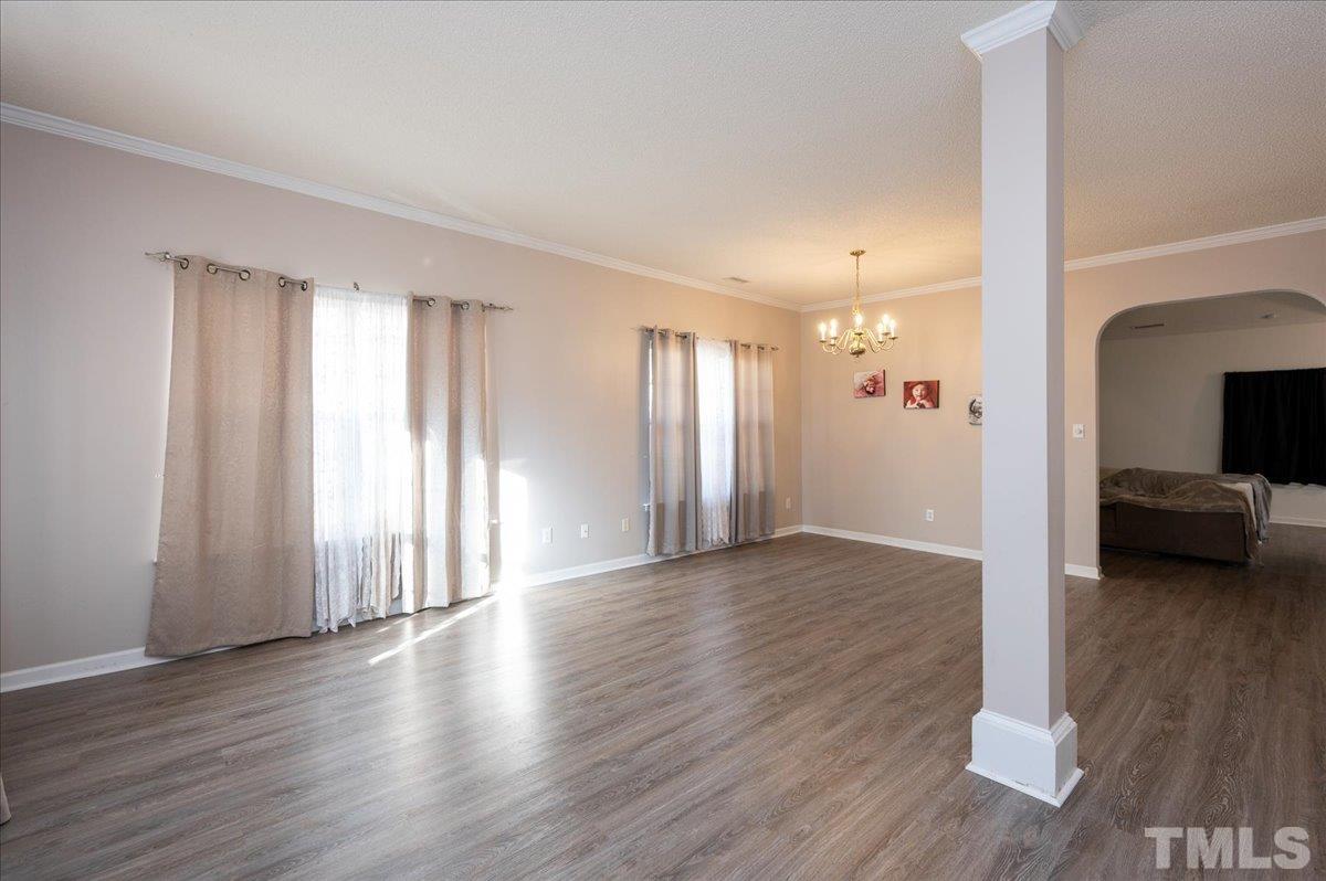 8616 Neuse Stone Drive Raleigh, NC 27616 - Photo 3 of 24 a view of a room with wooden floor and window