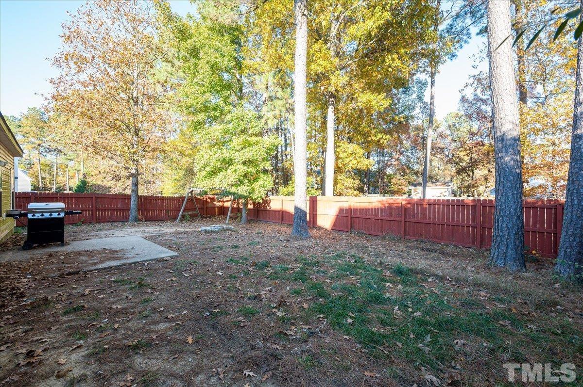 8616 Neuse Stone Drive Raleigh, NC 27616 - Photo 23 of 24 a view of yard with seating space