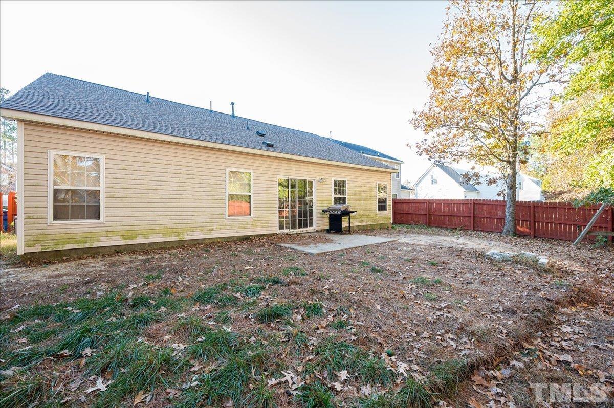 8616 Neuse Stone Drive Raleigh, NC 27616 - Photo 24 of 24 a view of a house with a backyard