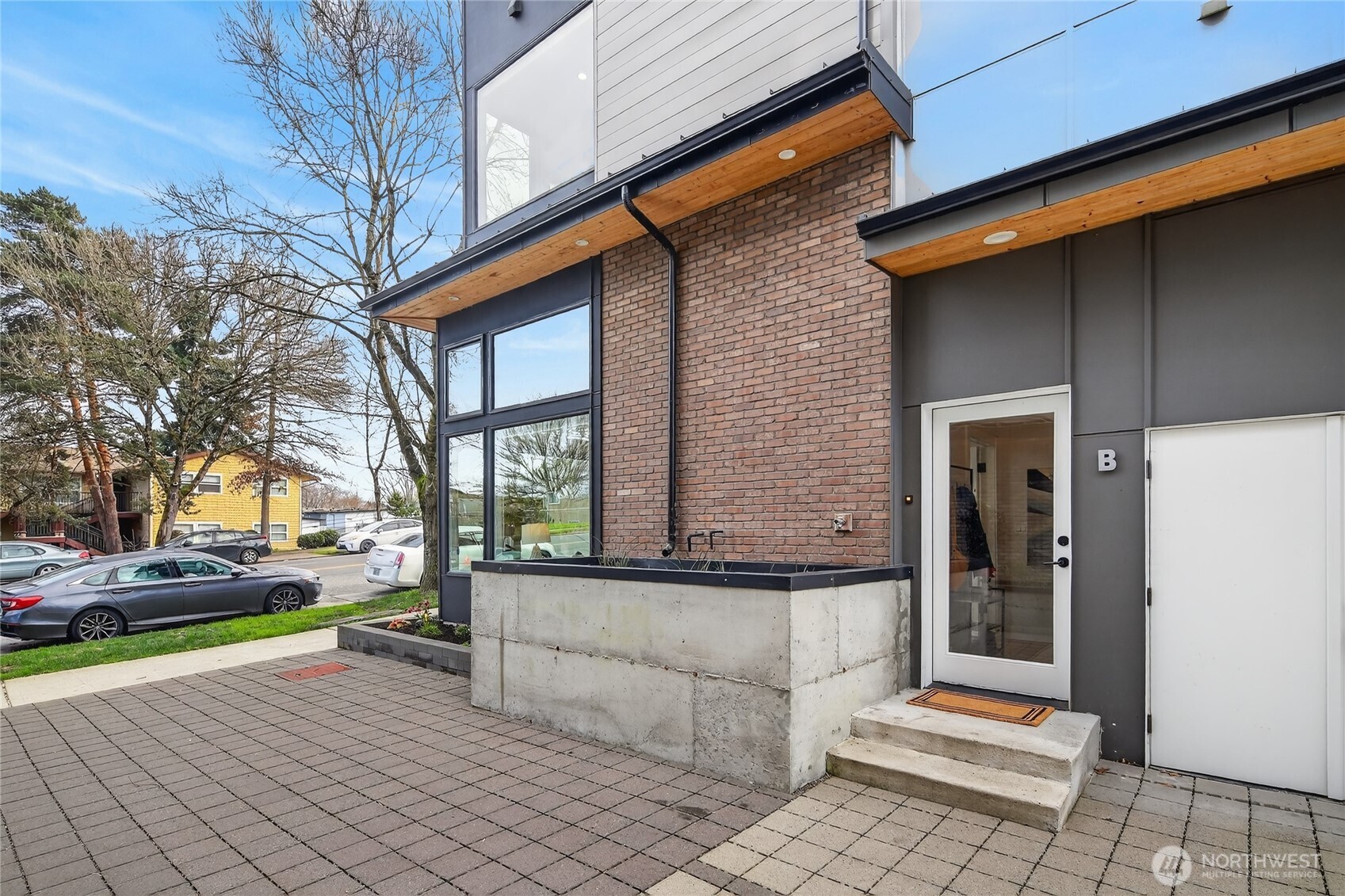 6543 35th Avenue Southwest, Unit B Seattle, WA 98126 - Photo 11 of 37 a view of a building with sitting area