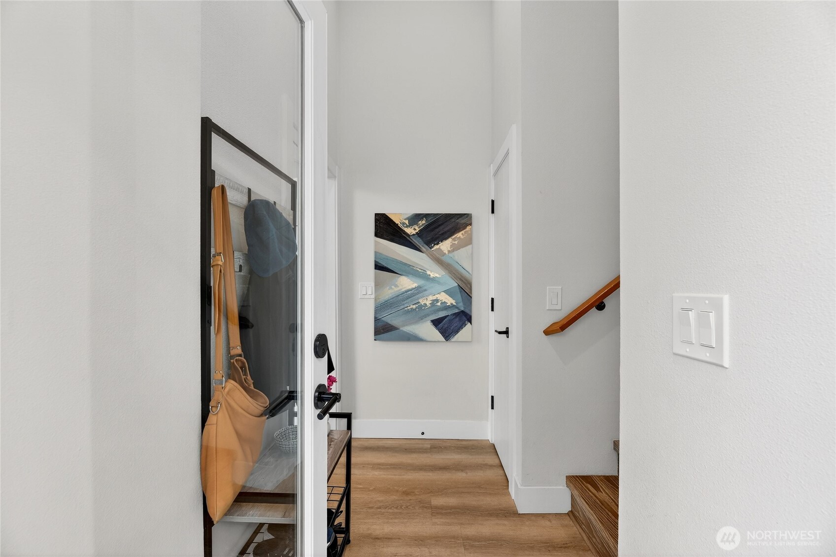 6543 35th Avenue Southwest, Unit B Seattle, WA 98126 - Photo 13 of 37 a view of a hallway with wooden floor and entryway