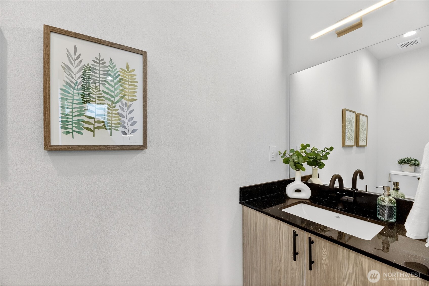 6543 35th Avenue Southwest, Unit B Seattle, WA 98126 - Photo 21 of 37 a room with a sink and a potted plant