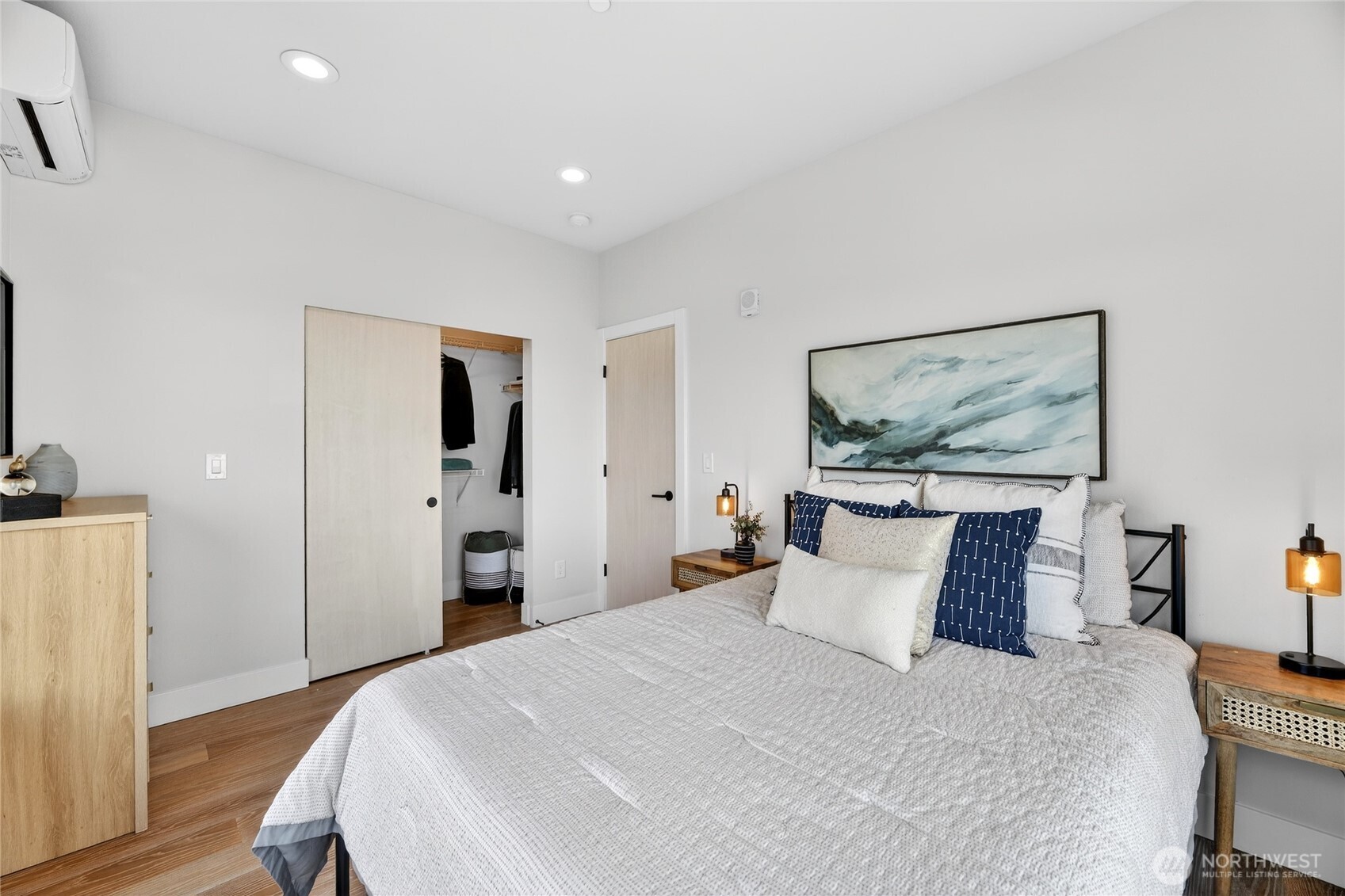 6543 35th Avenue Southwest, Unit B Seattle, WA 98126 - Photo 25 of 37 a bedroom with a bed and a painting on the wall