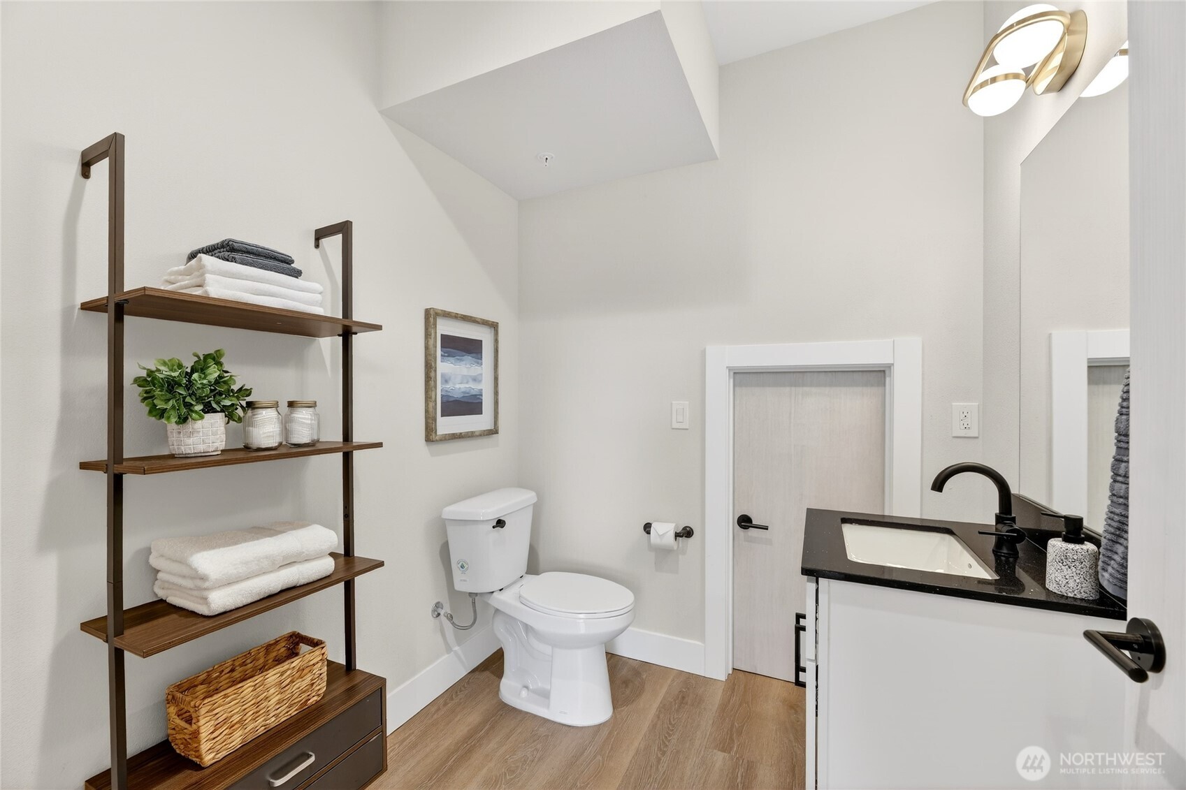 6543 35th Avenue Southwest, Unit B Seattle, WA 98126 - Photo 10 of 37 a bathroom with a toilet a sink and a window
