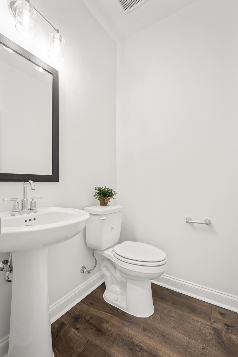 1719 Merkel Road Columbia, TN 38401 - Photo 12 of 69 a bathroom with a toilet a sink and mirror
