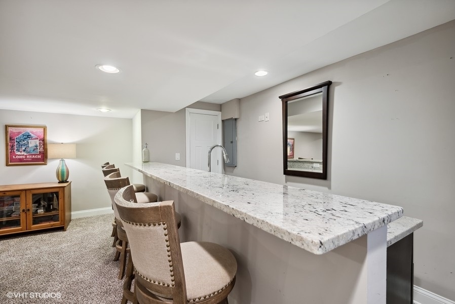 537 Romona Road Wilmette, IL 60091 - Photo 21 of 35 a living room with furniture and a table