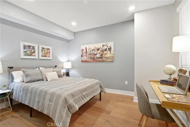 a bedroom with a bed and a lamp on table