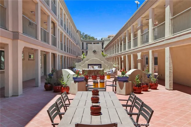 a view of a patio with couches table and chairs
