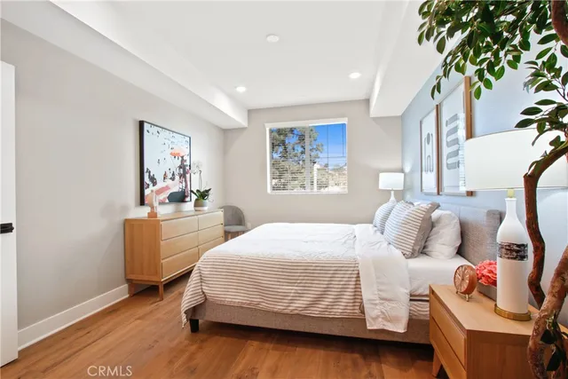 a bedroom with a bed and a couch