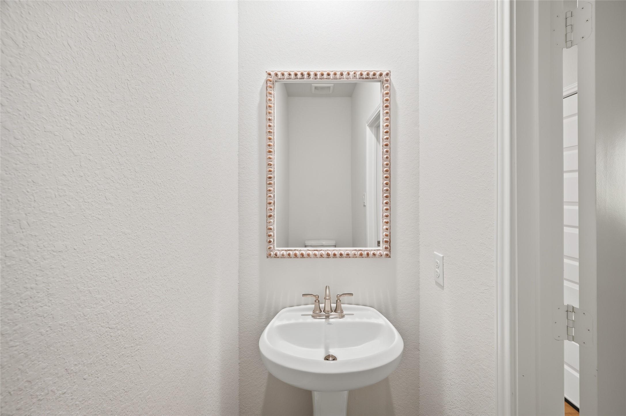 13419 Maverick Trail Road Conroe, TX 77303 - Photo 27 of 49 Convenient powder room with pedestal sink and stylish fixtures.