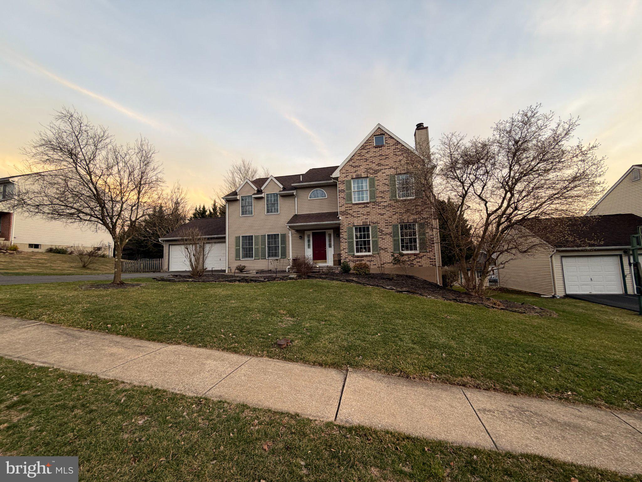 119 Constitution Avenue Reading, PA 19606 - Photo 1 of 15 a front view of a house with a yard