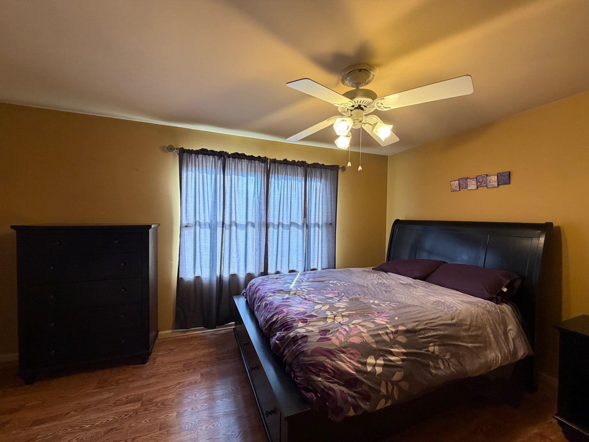 119 Constitution Avenue Reading, PA 19606 - Photo 12 of 15 a bedroom with a bed and a chandelier