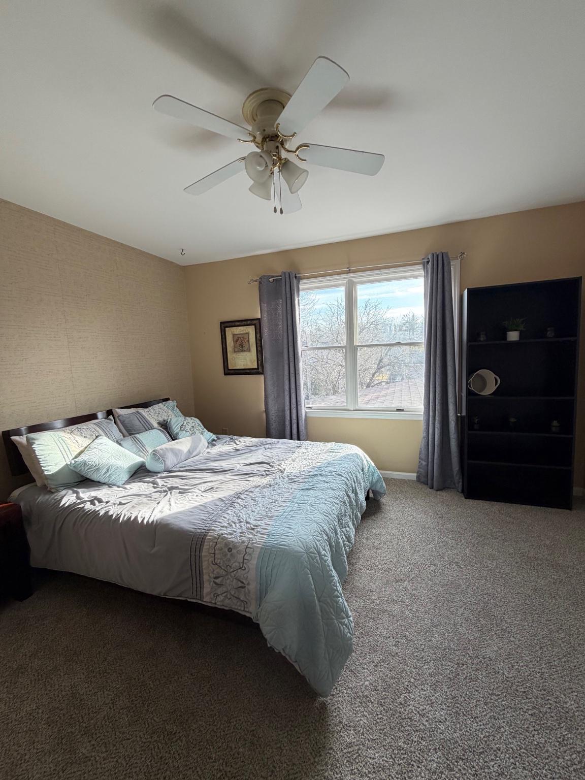 119 Constitution Avenue Reading, PA 19606 - Photo 13 of 15 a bedroom with a bed and a dresser