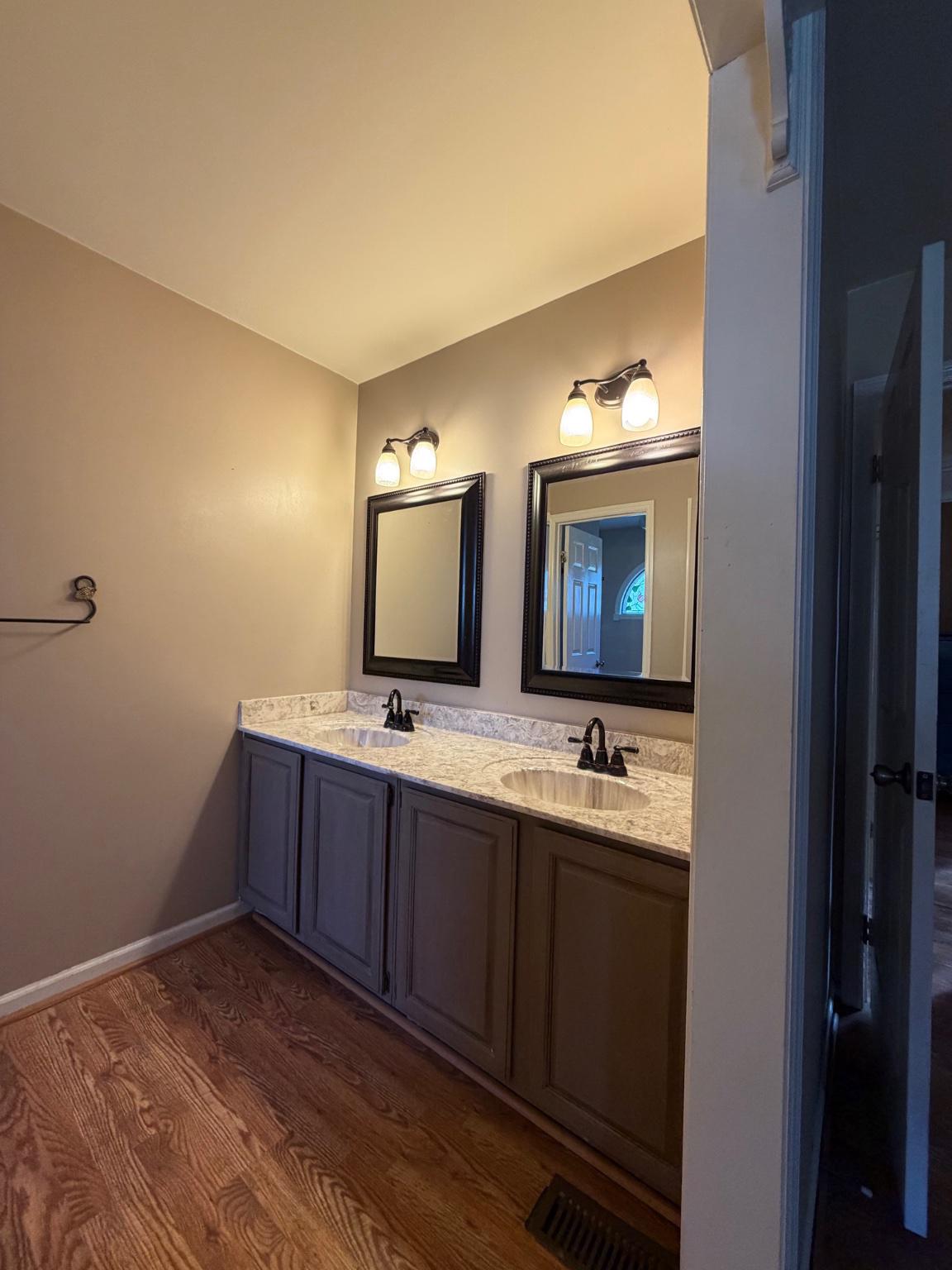 119 Constitution Avenue Reading, PA 19606 - Photo 15 of 15 a bathroom with a double vanity sink and mirror