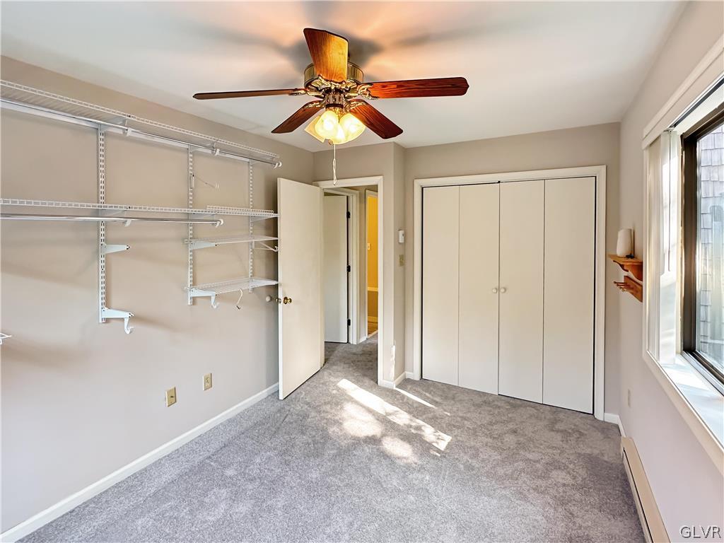 1432 Clover Road Long Pond, PA 18334 - Photo 8 of 16 a view of a livingroom with a ceiling fan and wooden floor