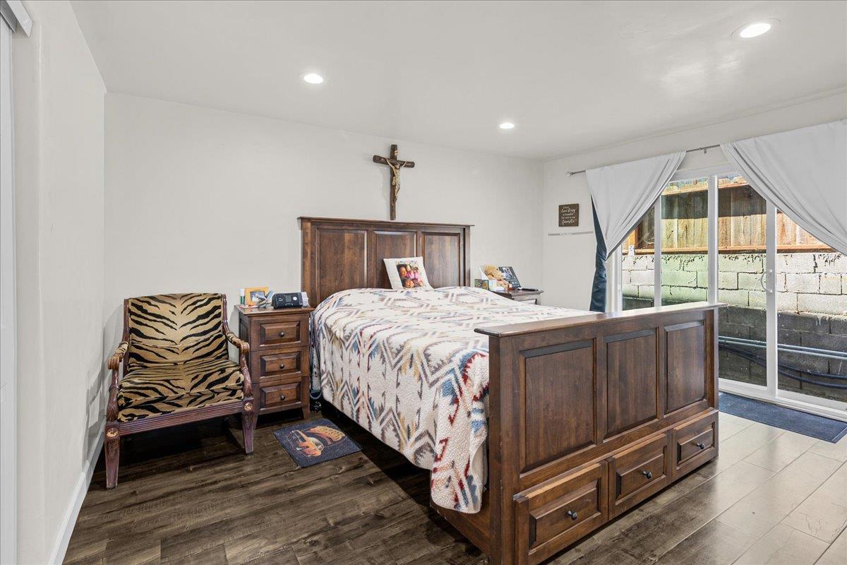 18810 Moro Road Salinas, CA 93907 - Photo 15 of 40 a bedroom with a bed and wooden floor