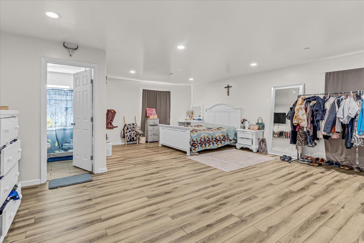18810 Moro Road Salinas, CA 93907 - Photo 17 of 40 a room with a bed and a view of living room