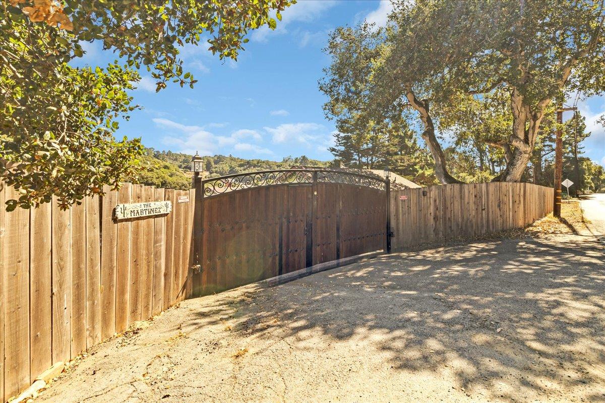 18810 Moro Road Salinas, CA 93907 - Photo 2 of 40 a view of a backyard with wooden fence and a large tree