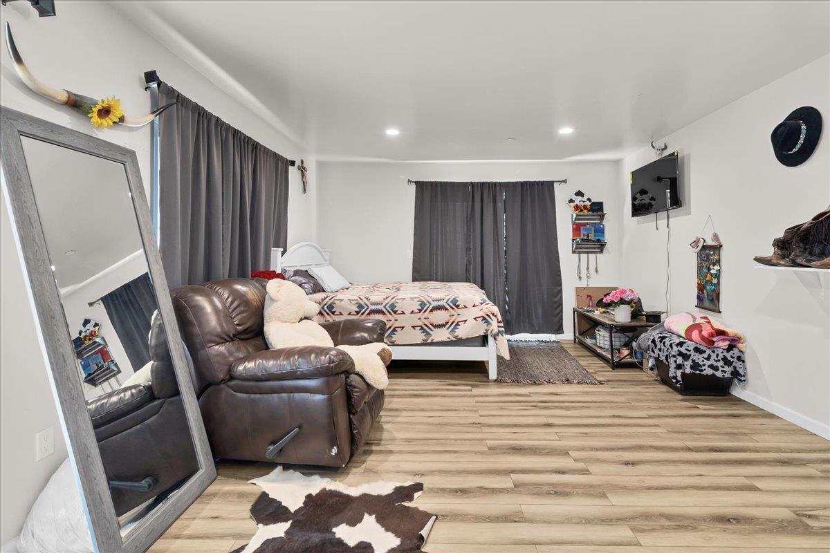 18810 Moro Road Salinas, CA 93907 - Photo 22 of 40 a bedroom with furniture and a fireplace