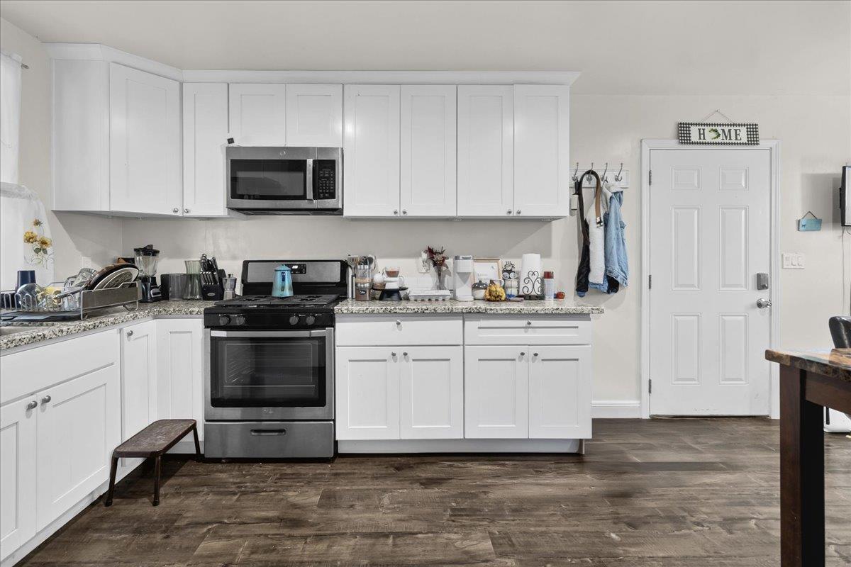 18810 Moro Road Salinas, CA 93907 - Photo 27 of 40 a kitchen with white cabinets and appliances