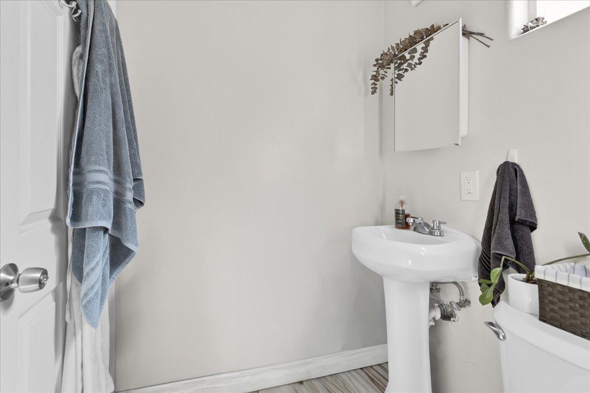 18810 Moro Road Salinas, CA 93907 - Photo 31 of 40 a bathroom with a sink and mirror with window