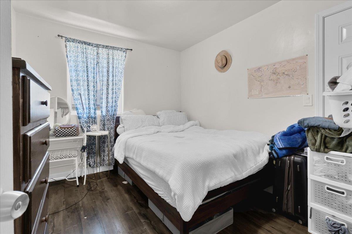 18810 Moro Road Salinas, CA 93907 - Photo 32 of 40 a bedroom with a bed and wooden floor