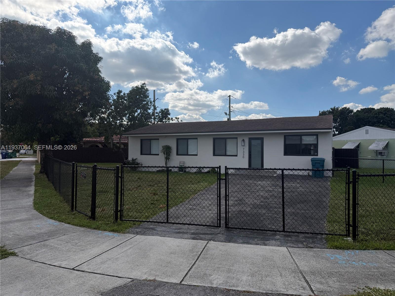 a view of a house next to a yard