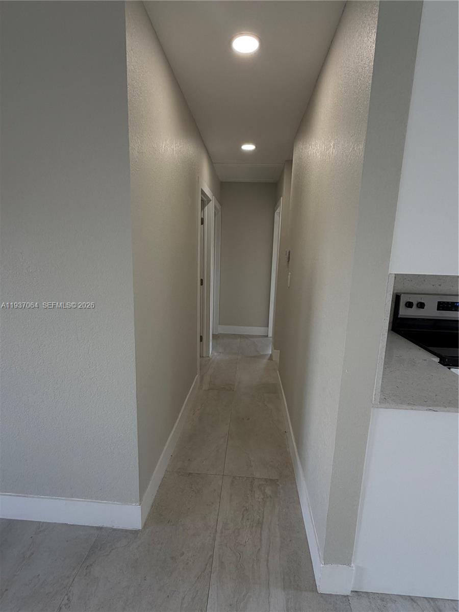 7330 Southwest 11th Street, Unit 7330 Miami, FL 33144 - Photo 17 of 25 a view of hallway with a rug