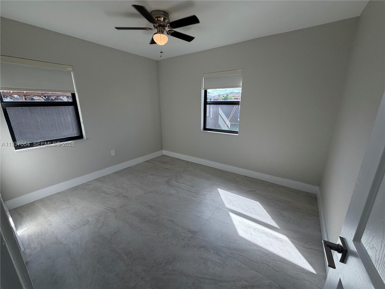 7330 Southwest 11th Street, Unit 7330 Miami, FL 33144 - Photo 21 of 25 a view of an empty room and a window