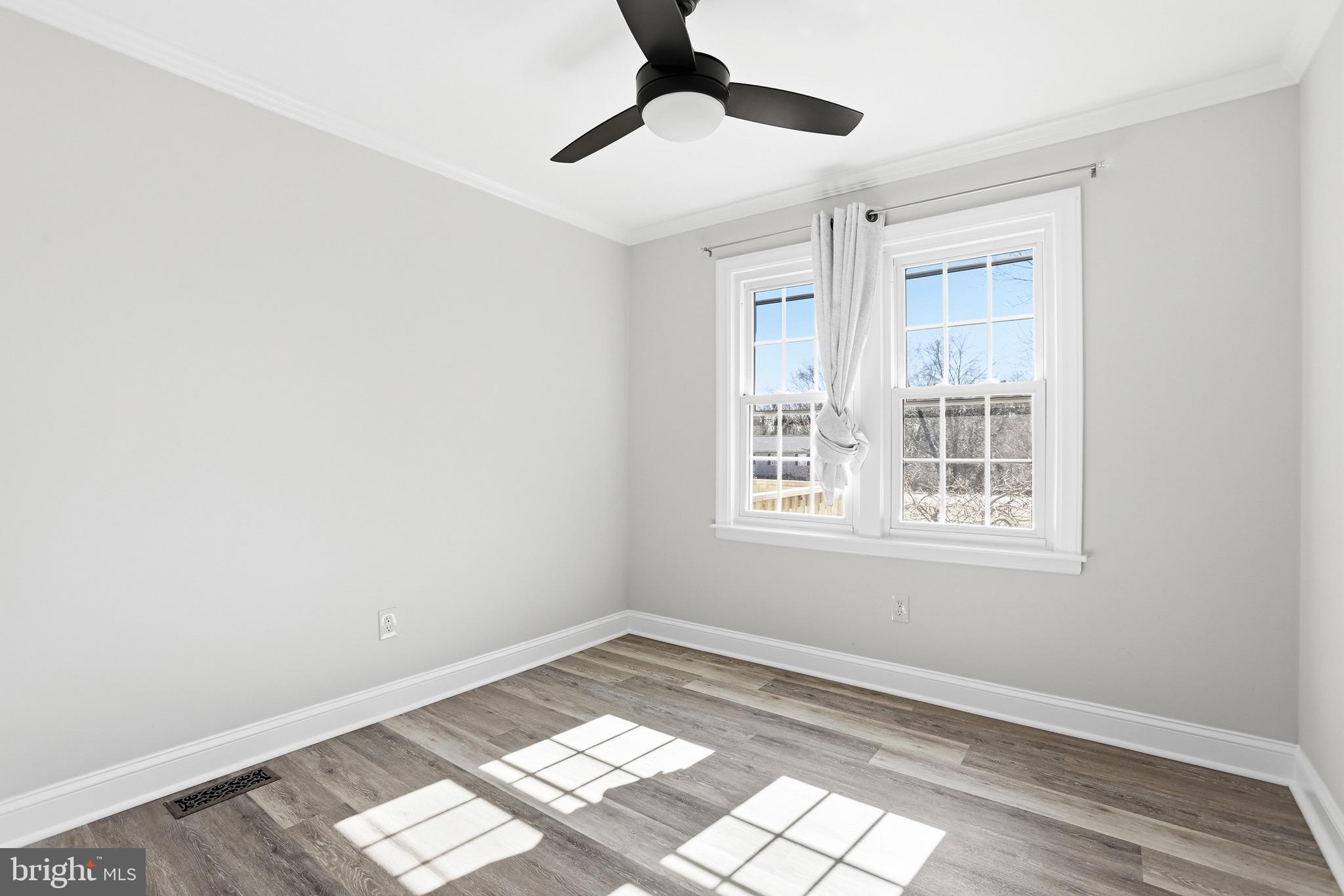 8324 Newland Road Warsaw, VA 22572 - Photo 15 of 31 a view of an empty room and window