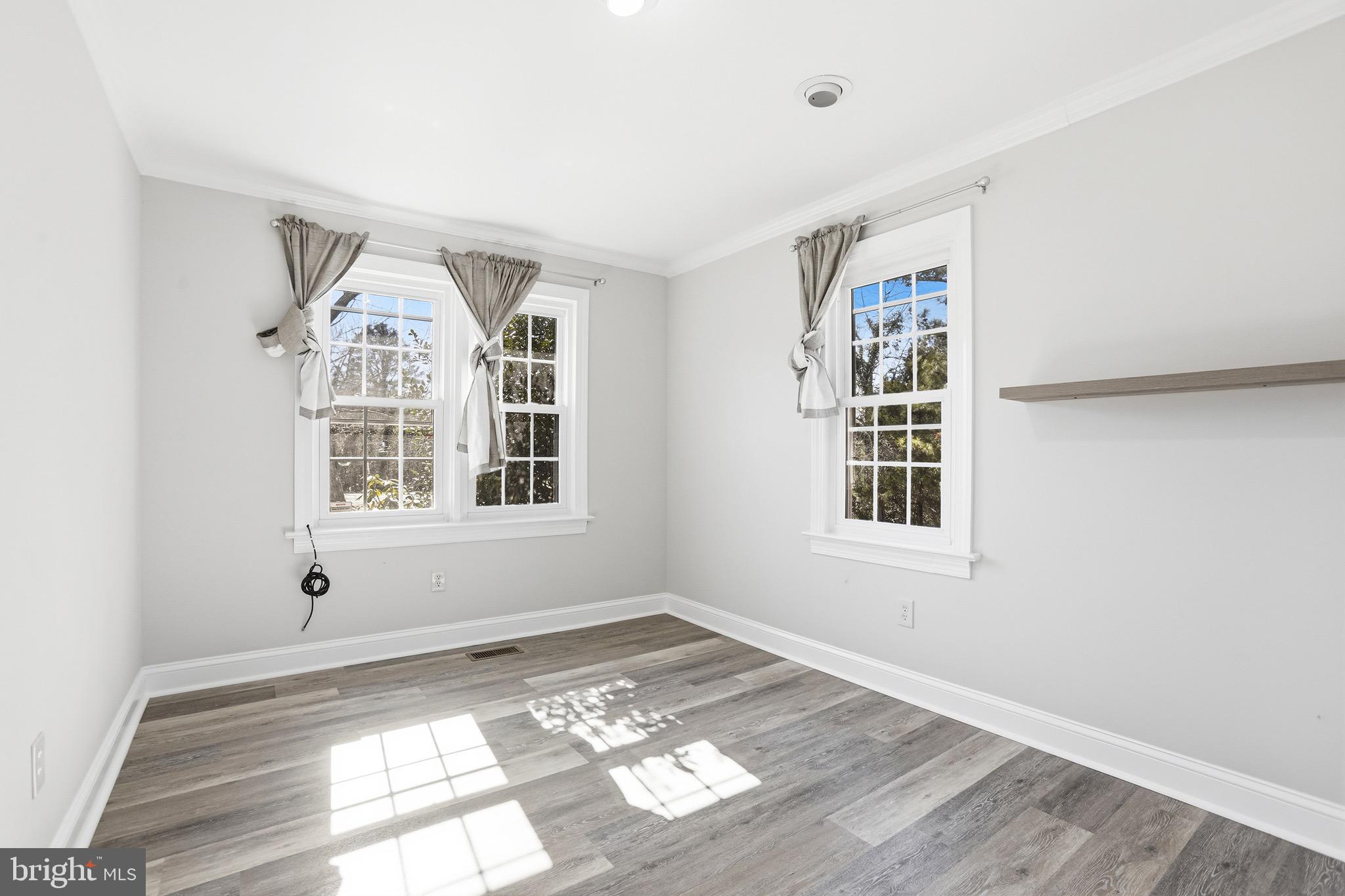 8324 Newland Road Warsaw, VA 22572 - Photo 18 of 31 a view of an empty room with a window