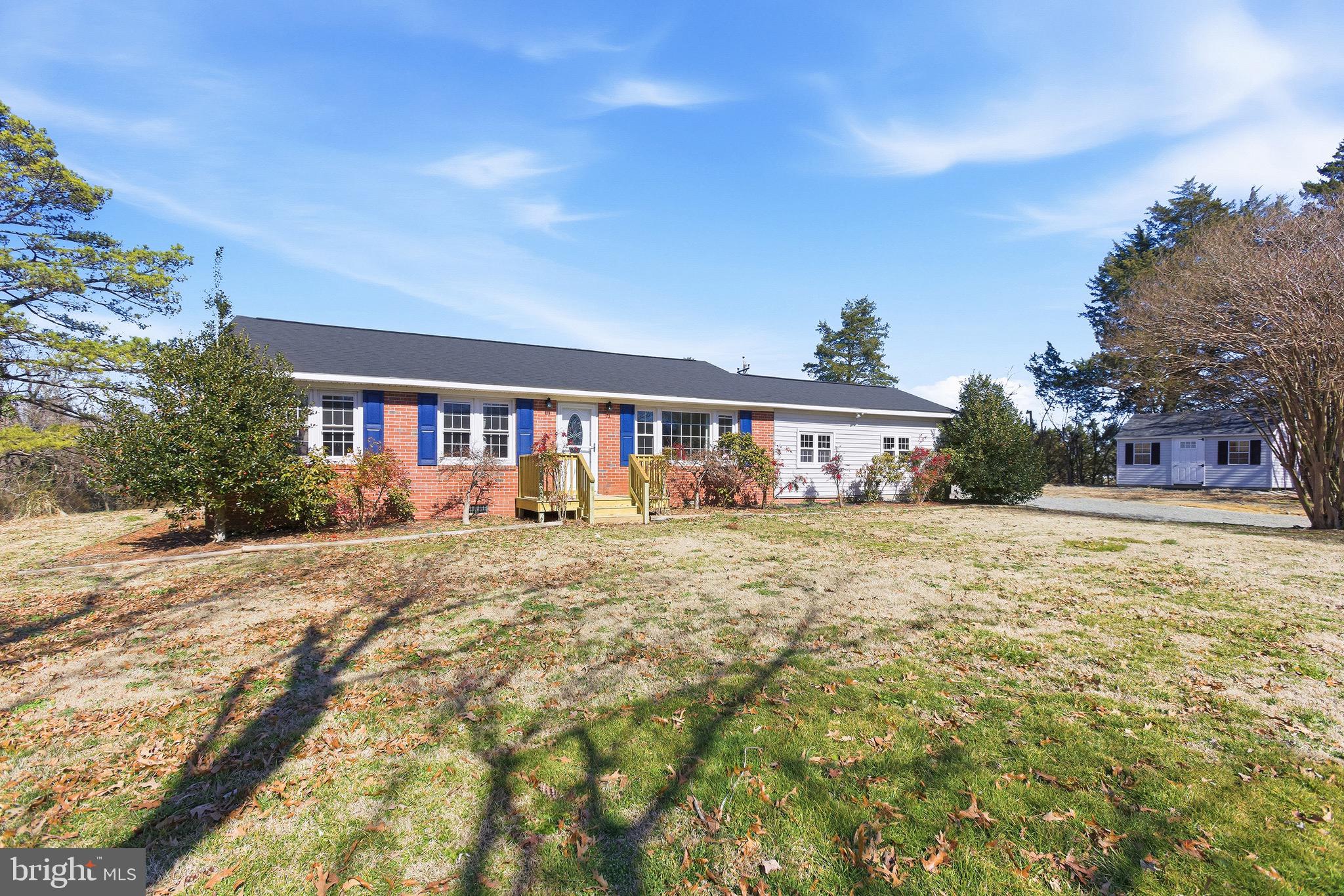 8324 Newland Road Warsaw, VA 22572 - Photo 25 of 31 a front view of a house with a yard