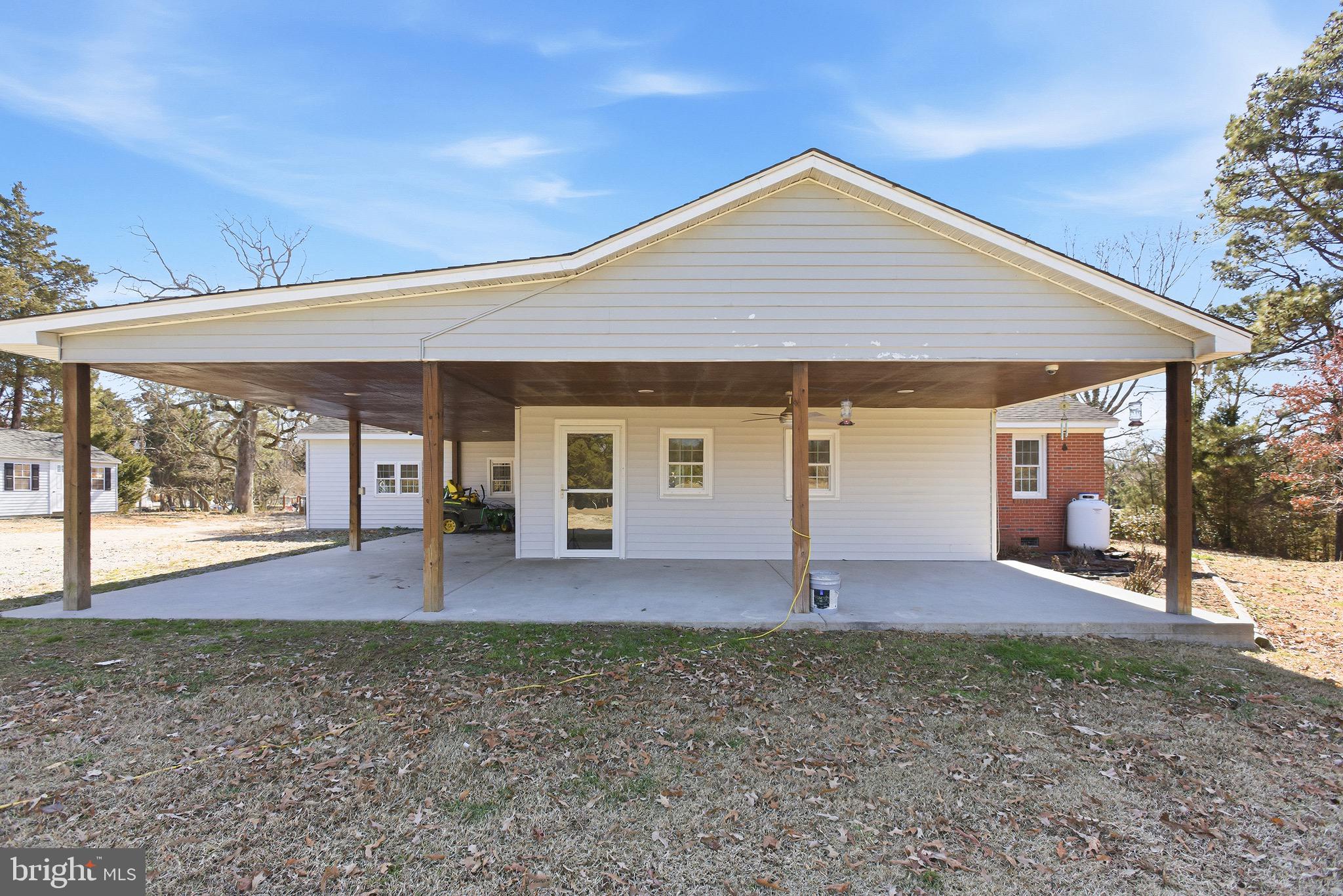 8324 Newland Road Warsaw, VA 22572 - Photo 28 of 31 front view of a house with a yard