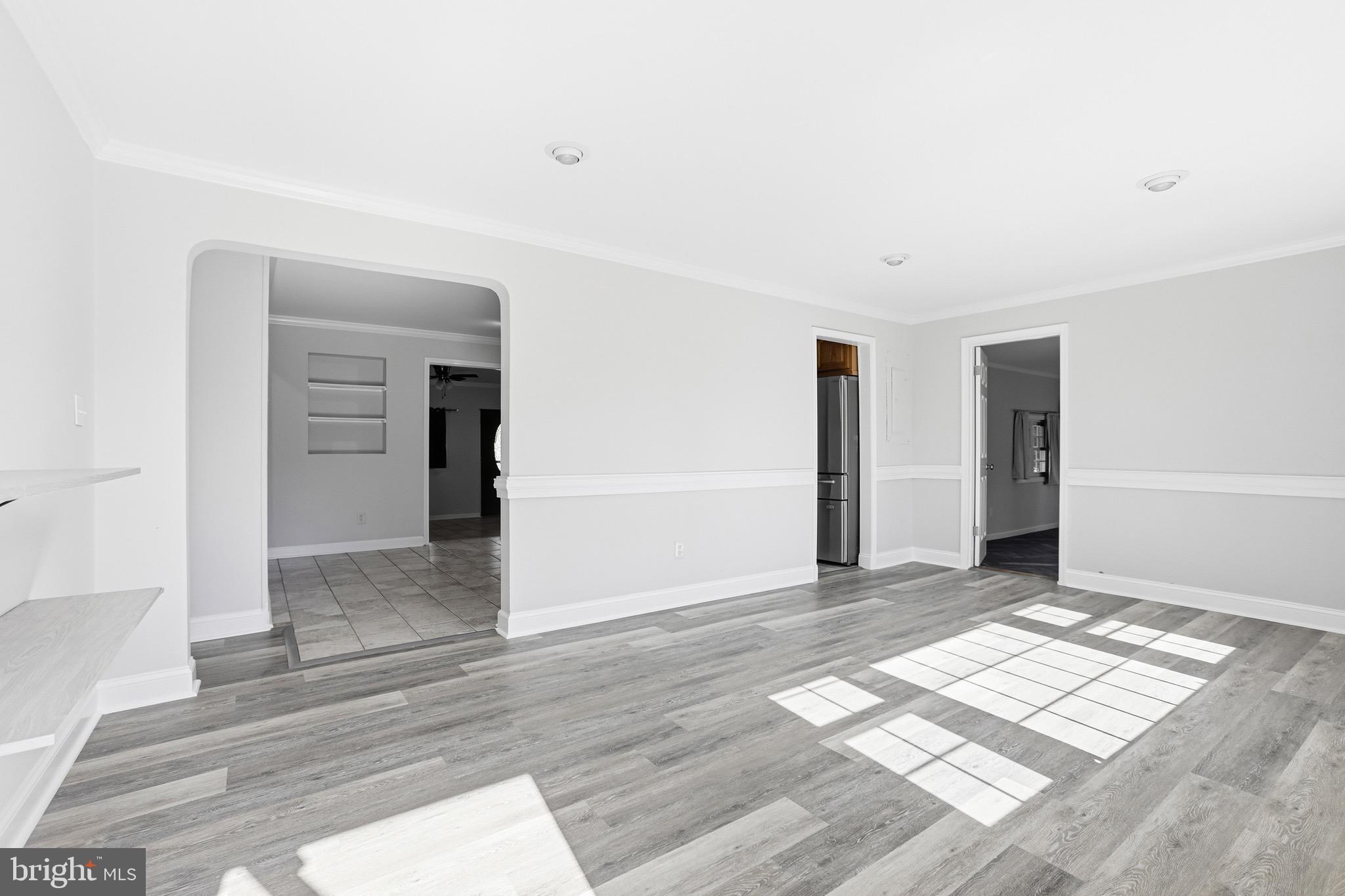8324 Newland Road Warsaw, VA 22572 - Photo 3 of 31 a view of empty room with wooden floor