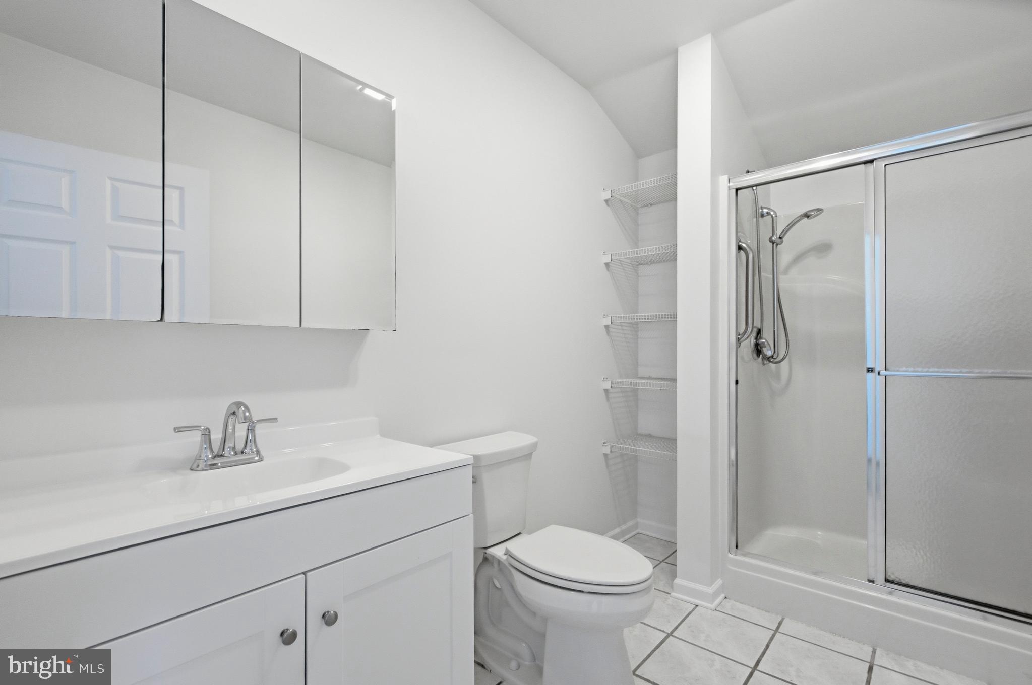 220 Solway Road Lutherville-Timonium, MD 21093 - Photo 29 of 38 a bathroom with a sink toilet and shower